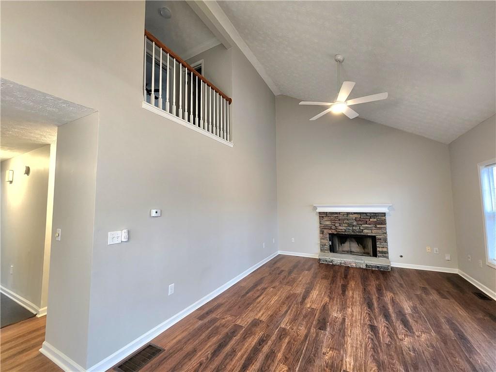 1645 Rushing River Way Suwanee, GA 30024 - Photo 15 of 38 wooden floor in an empty room with a window
