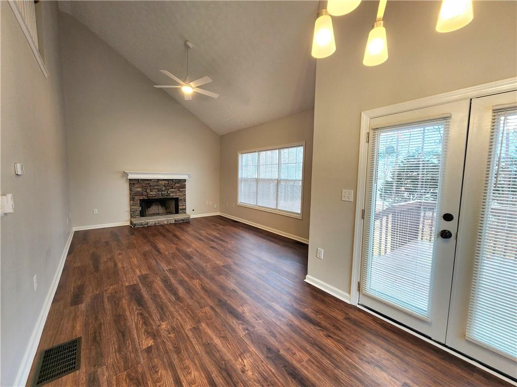 1645 Rushing River Way Suwanee, GA 30024 - Photo 16 of 38 a view of empty room with wooden floor and fan