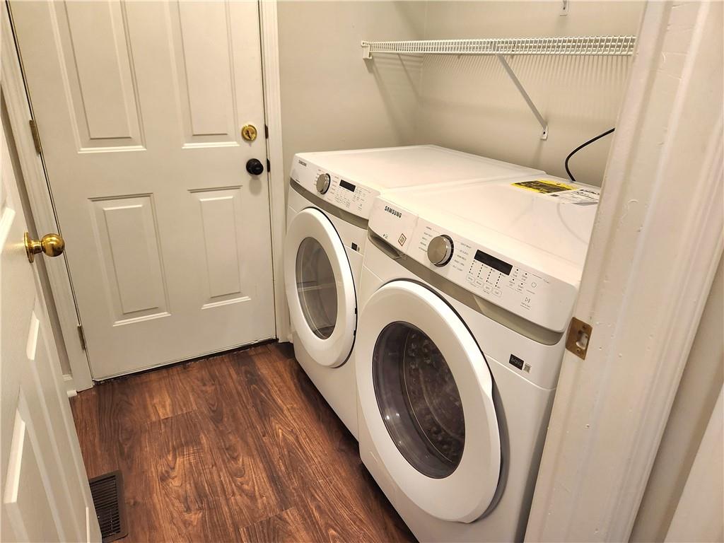 1645 Rushing River Way Suwanee, GA 30024 - Photo 18 of 38 a utility room with dryer and washer