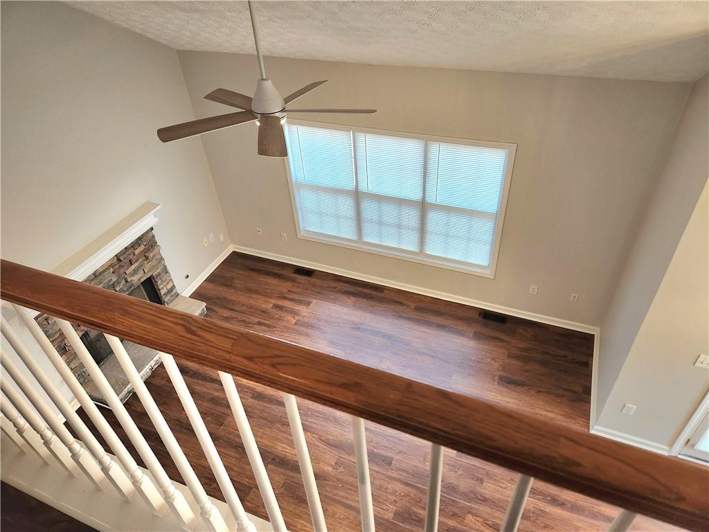 1645 Rushing River Way Suwanee, GA 30024 - Photo 22 of 38 a view of a room with wooden floor and windows