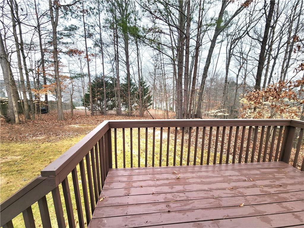 1645 Rushing River Way Suwanee, GA 30024 - Photo 36 of 38 a view of balcony with wooden floor and fence