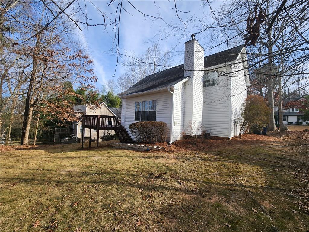 1645 Rushing River Way Suwanee, GA 30024 - Photo 37 of 38 a backyard of a house with shaded area