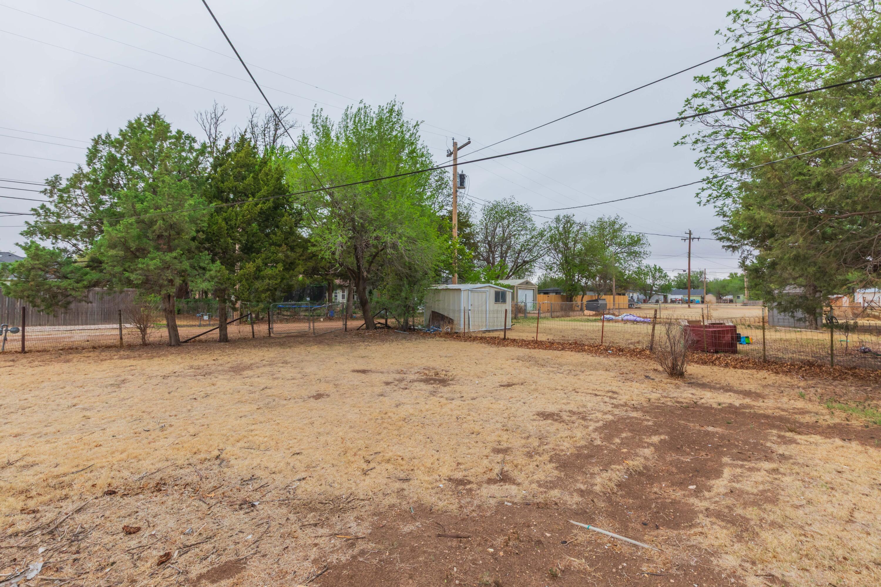 504 High Street Claude, TX 79019 - Photo 36 of 39 a backyard of a house with lots of green space