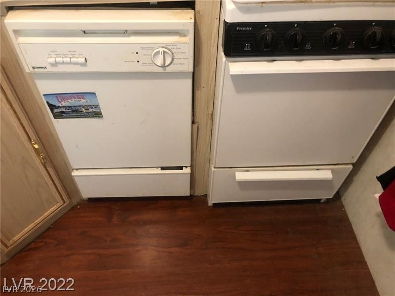 209 Euclid Avenue Goldfield, NV 89013 - Photo 11 of 18 Kitchen view of white dishwasher and dark wood finished floors