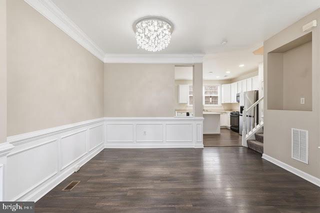 15683 Avocet Loop Woodbridge, VA 22191 - Photo 15 of 38 a view of kitchen with cabinets and wooden floor
