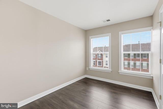 15683 Avocet Loop Woodbridge, VA 22191 - Photo 18 of 38 an empty room with wooden floor and windows