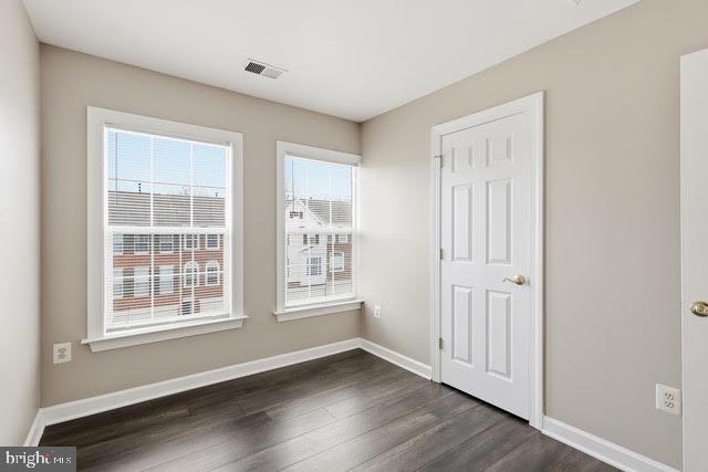 15683 Avocet Loop Woodbridge, VA 22191 - Photo 20 of 38 an empty room with wooden floor and windows