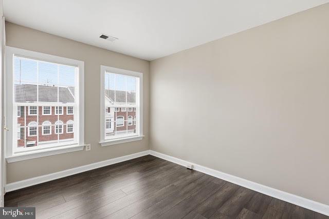 15683 Avocet Loop Woodbridge, VA 22191 - Photo 21 of 38 an empty room with wooden floor and windows