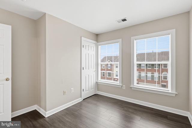 15683 Avocet Loop Woodbridge, VA 22191 - Photo 22 of 38 an empty room with wooden floor and windows