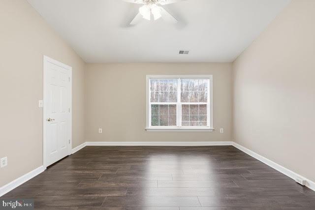 15683 Avocet Loop Woodbridge, VA 22191 - Photo 24 of 38 an empty room with wooden floor and windows
