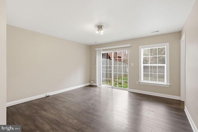 15683 Avocet Loop Woodbridge, VA 22191 - Photo 27 of 38 an empty room with wooden floor and windows