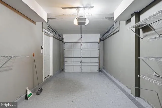 a view of room that has a white car parked