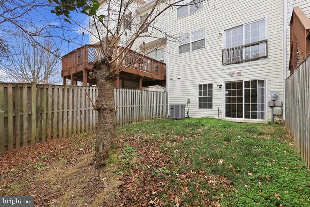 15683 Avocet Loop Woodbridge, VA 22191 - Photo 38 of 38 a view of a house with a small yard and wooden fence