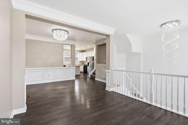 15683 Avocet Loop Woodbridge, VA 22191 - Photo 6 of 38 a view of a hallway with wooden floor