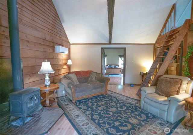 a living room with furniture fireplace and flat screen tv