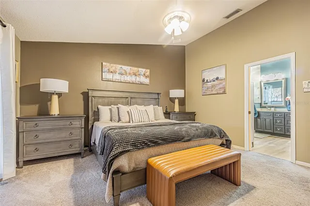 a view of a dining room with furniture and a chandelier