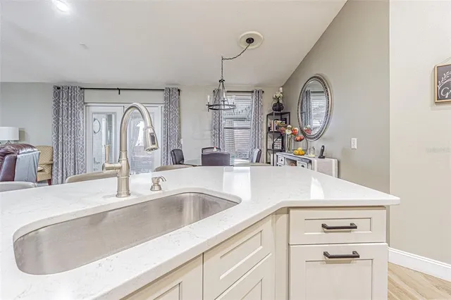 a kitchen with stainless steel appliances a stove refrigerator and a microwave