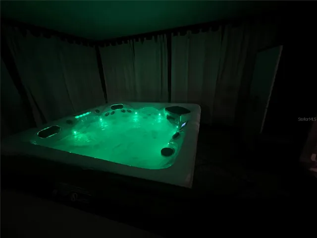 an aerial view of a house having swimming pool