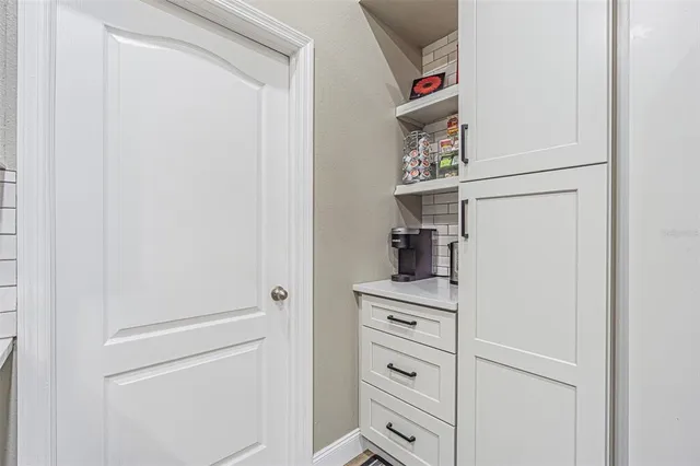 a kitchen with stainless steel appliances kitchen island granite countertop a sink and cabinets
