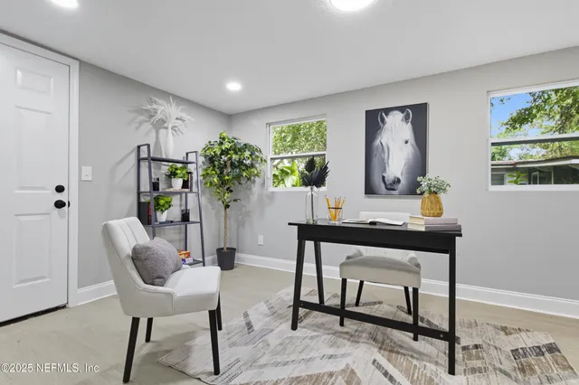 a workspace with furniture and window