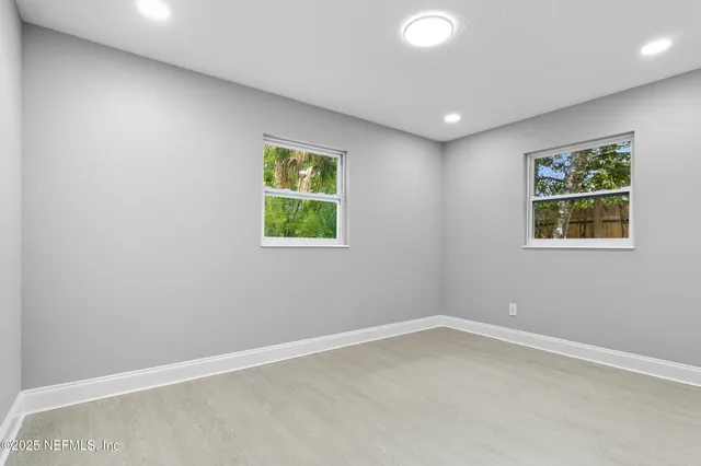 an empty room with windows