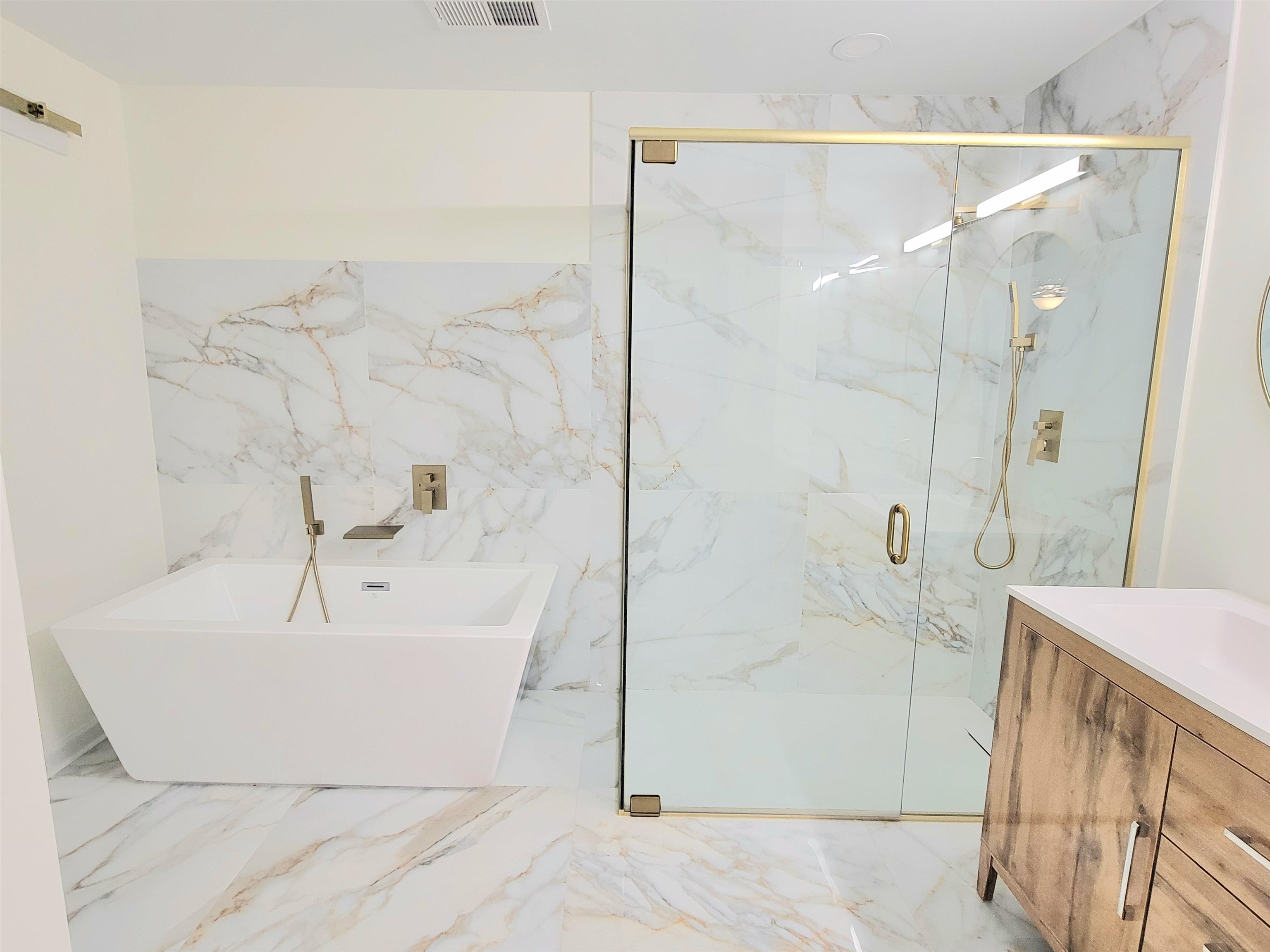 251 East Mitchell Road Memphis, TN 38109 - Photo 14 of 24 Bathroom featuring vanity and separate shower and tub