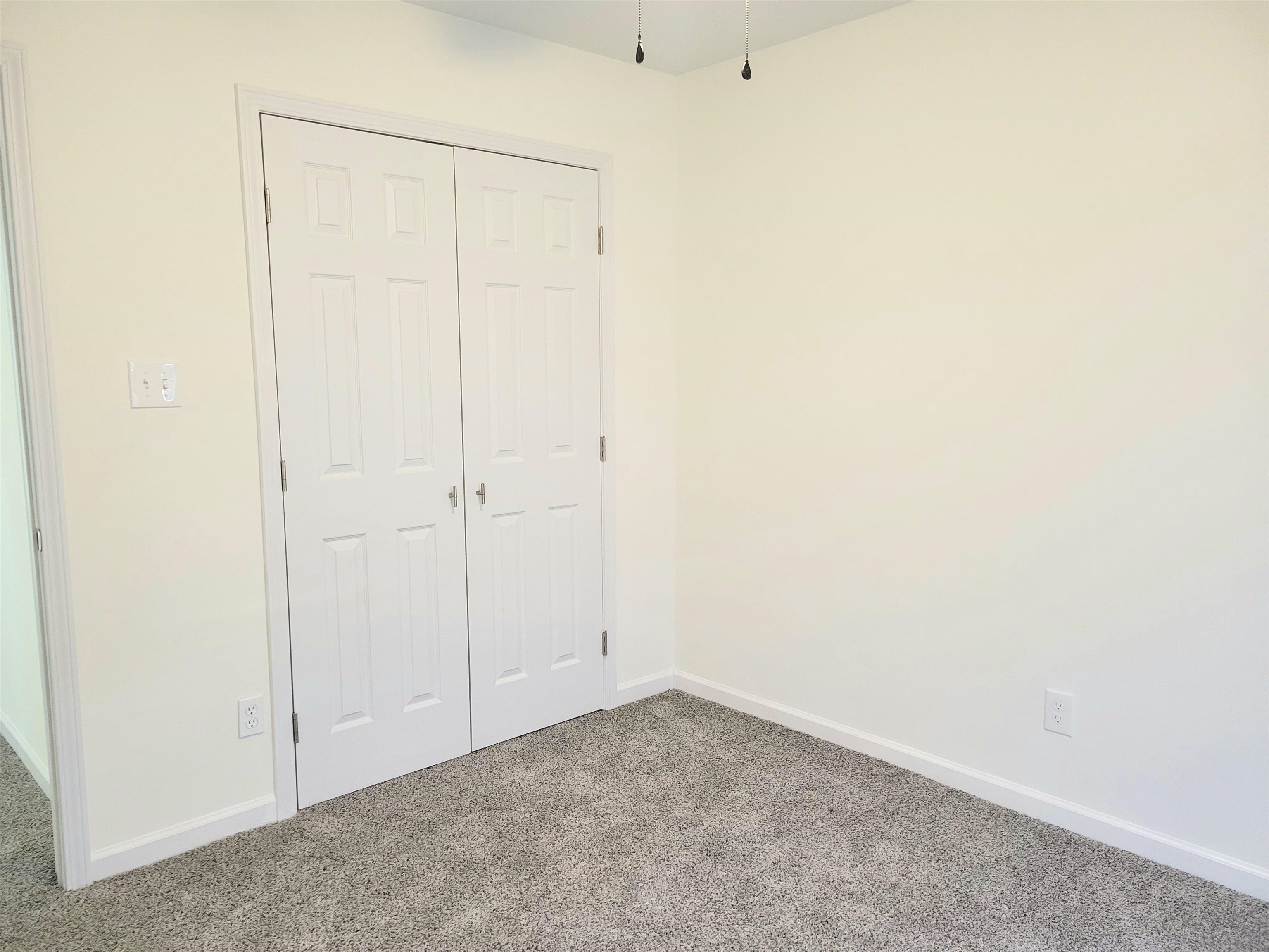 251 East Mitchell Road Memphis, TN 38109 - Photo 16 of 24 Unfurnished bedroom featuring a closet and carpet floors