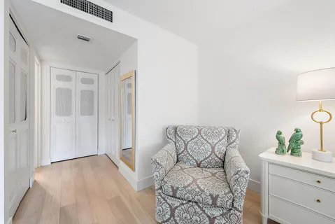 a view of kitchen with wooden floor and cabinet