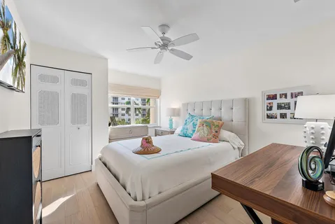 a bedroom with two beds and a table