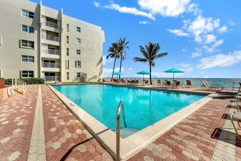 a view of swimming pool with a patio