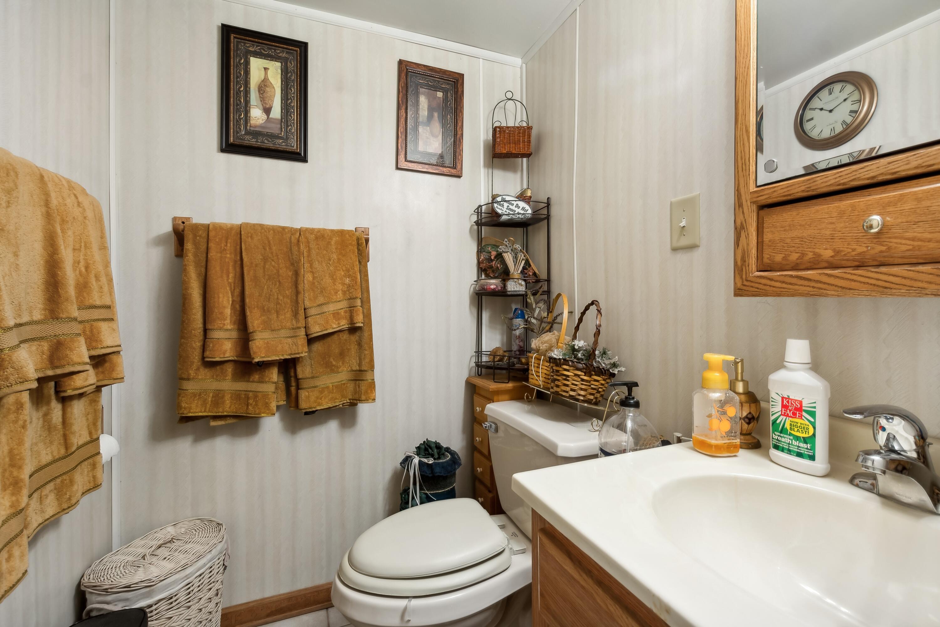 1701-1707 Mount Street Gary, IN 46404 - Photo 13 of 18 a bathroom with a sink toilet and mirror
