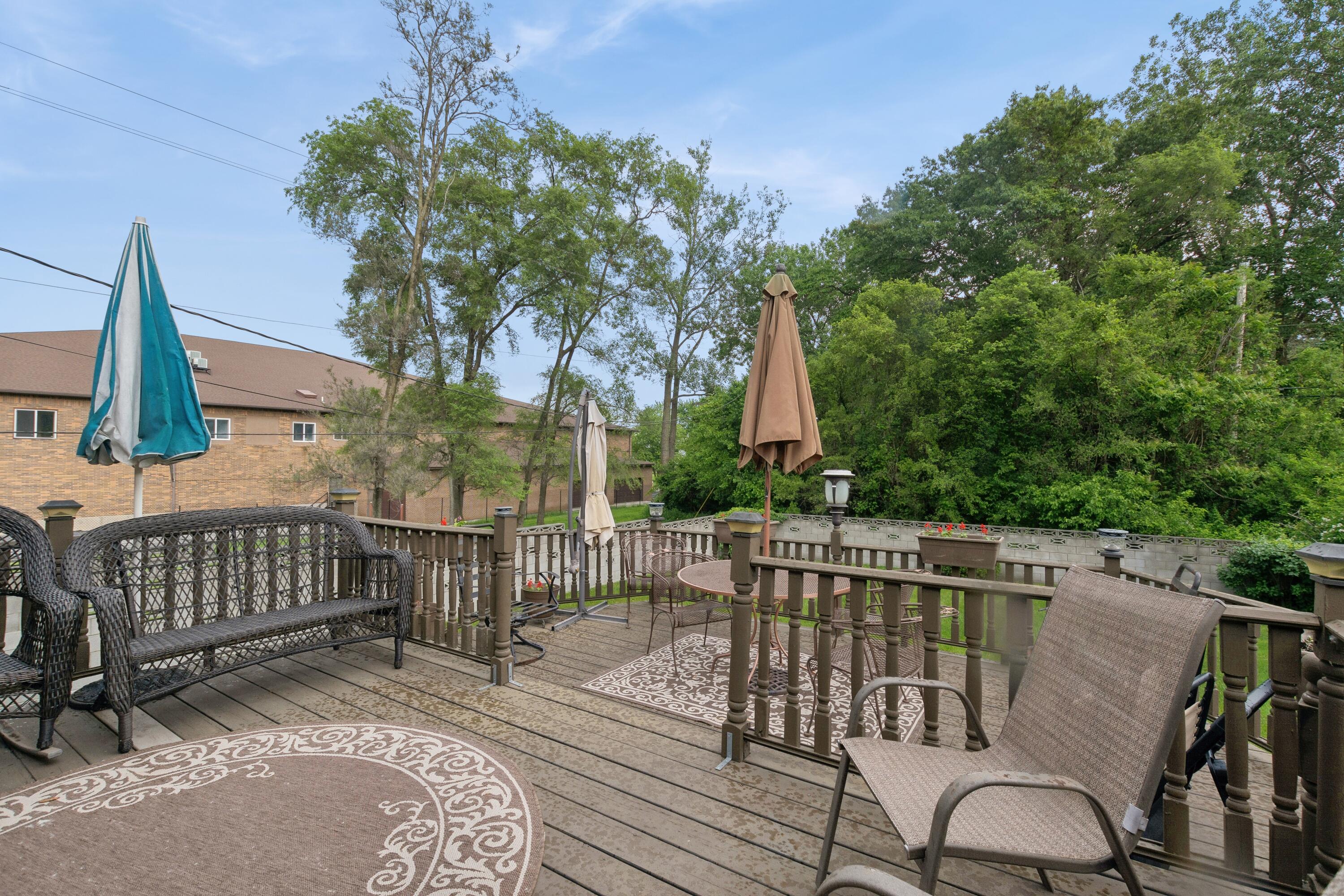 1701-1707 Mount Street Gary, IN 46404 - Photo 16 of 18 a view of balcony with wooden floor and outdoor seating