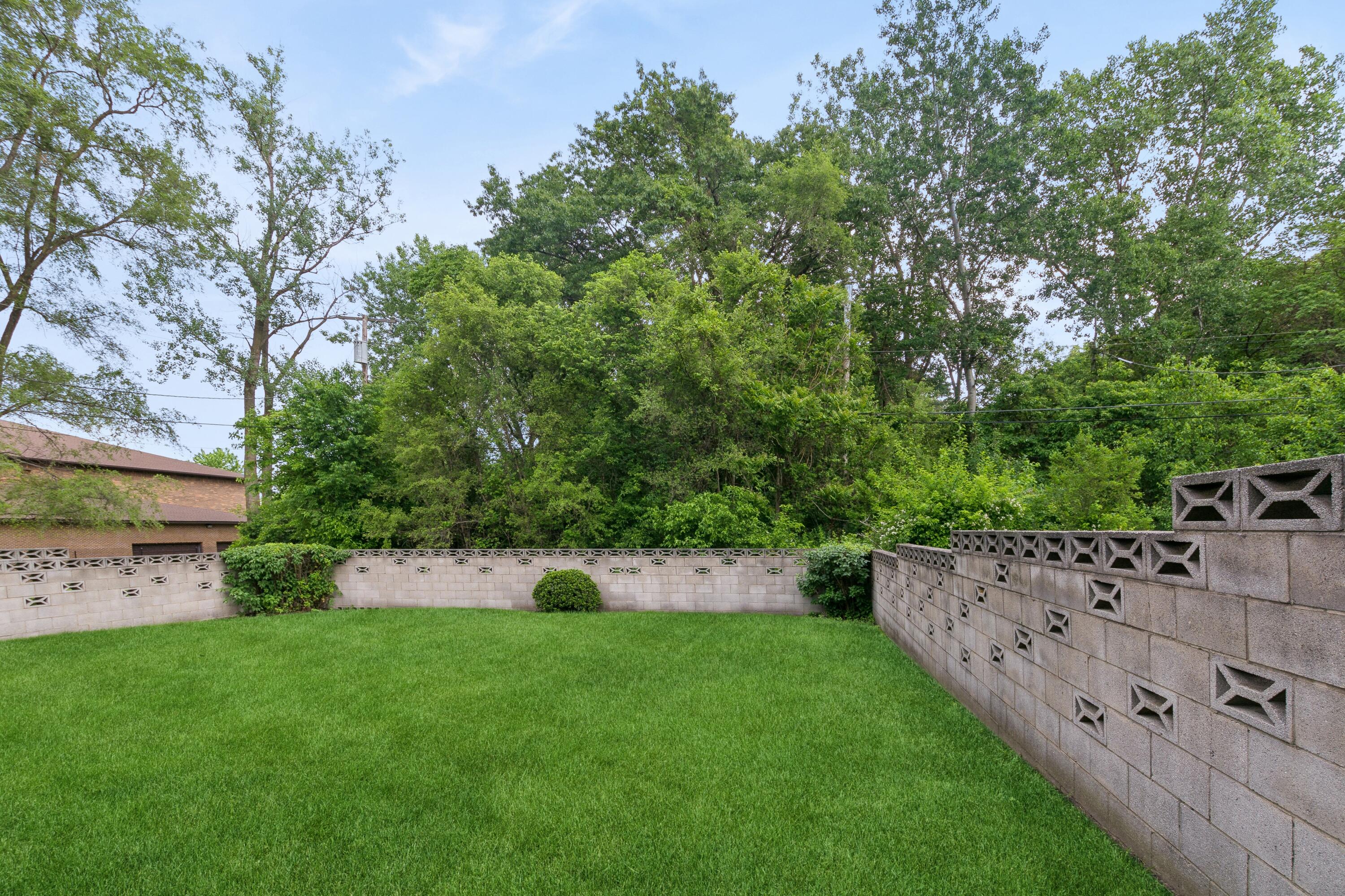 1701-1707 Mount Street Gary, IN 46404 - Photo 17 of 18 a view of a backyard with plants