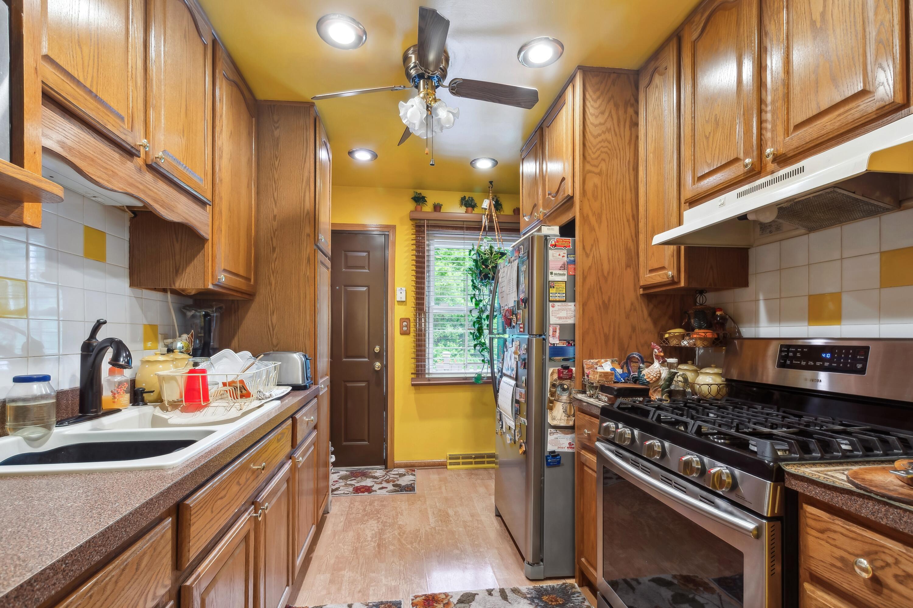 1701-1707 Mount Street Gary, IN 46404 - Photo 7 of 18 a kitchen with stainless steel appliances granite countertop a stove a sink and a refrigerator