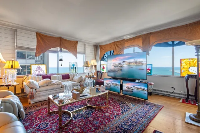 a living room with furniture and a rug