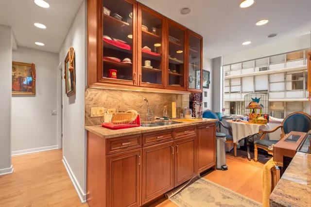 a kitchen that has a lot of cabinets in it