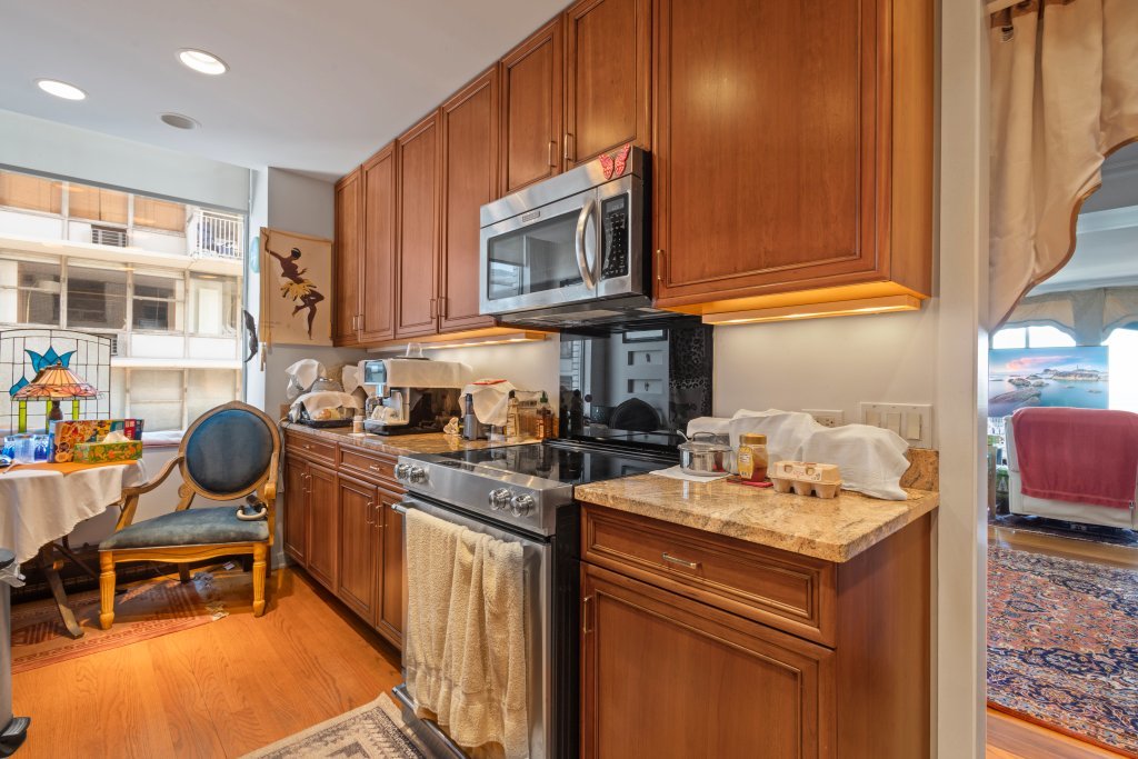 1000 North Lake Shore Plaza, Unit 13A Chicago, IL 60611 - Photo 16 of 30 a kitchen with a stove and a sink