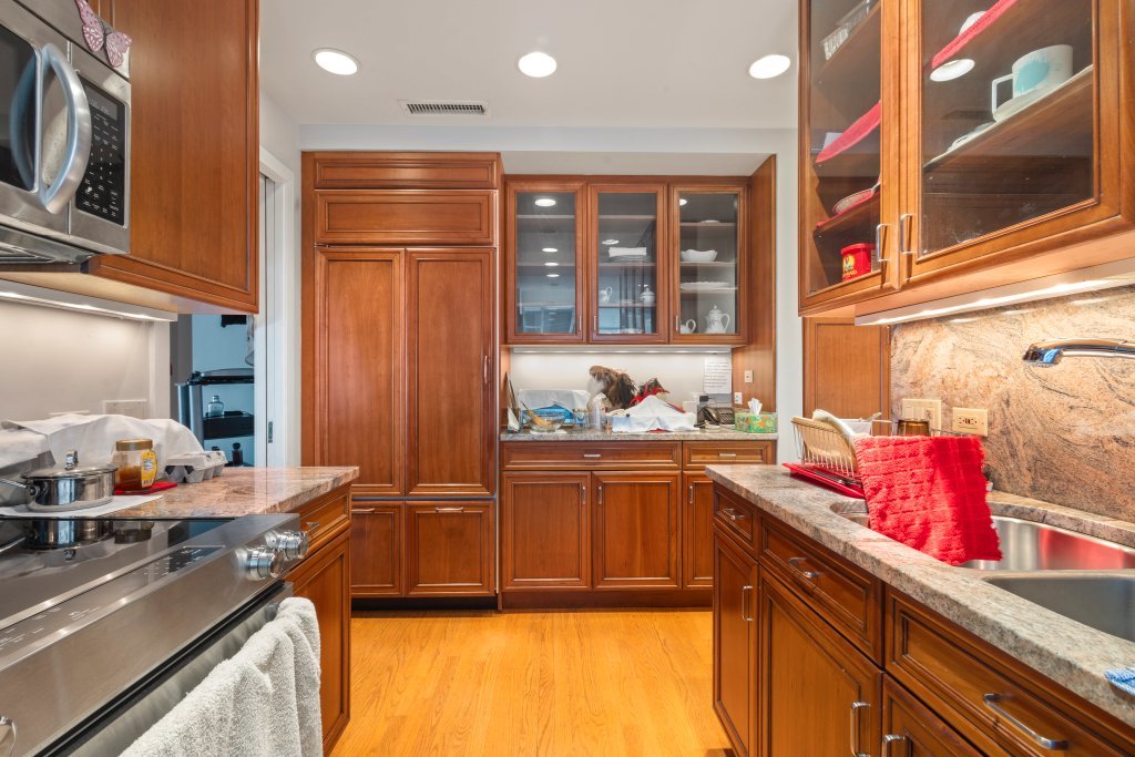 1000 North Lake Shore Plaza, Unit 13A Chicago, IL 60611 - Photo 17 of 30 a kitchen with stainless steel appliances granite countertop a sink stove and cabinets