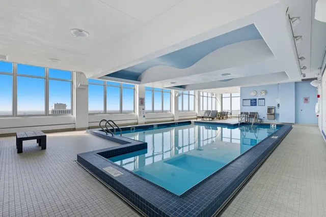 a living room with furniture pool table and a couch