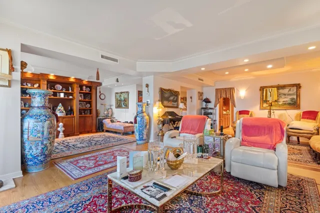 a living room filled with furniture and a table