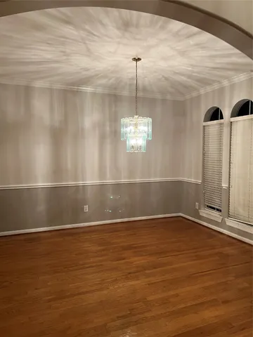 a view of a room with window and wooden floor