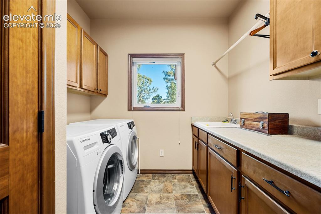 131 Paradiso Road Divide, CO 80814 - Photo 22 of 50 a view of a kitchen with washer and dryer