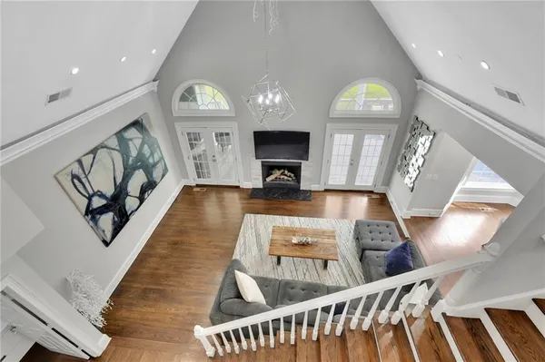 a spacious bedroom with a bed a couch and a window