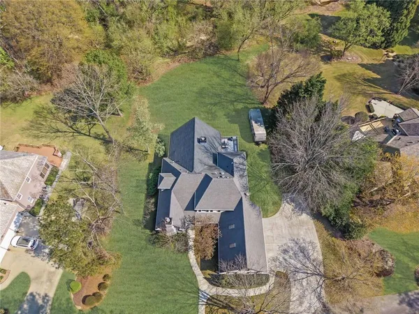 an aerial view of a house with a garden