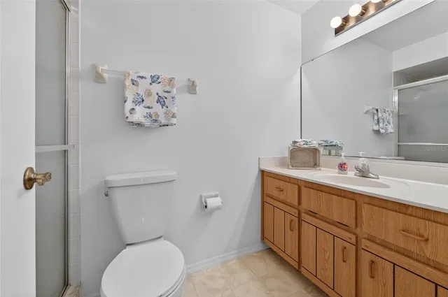 a view of a dining room with furniture large windows and wooden floor