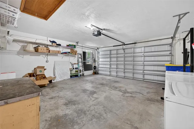 an aerial view of a house with outdoor space