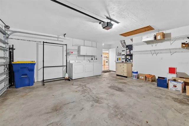 an aerial view of residential building and lake