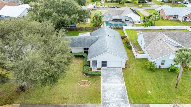 an aerial view of residential houses with outdoor space