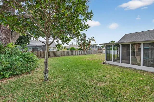 a view of a house with backyard and garden