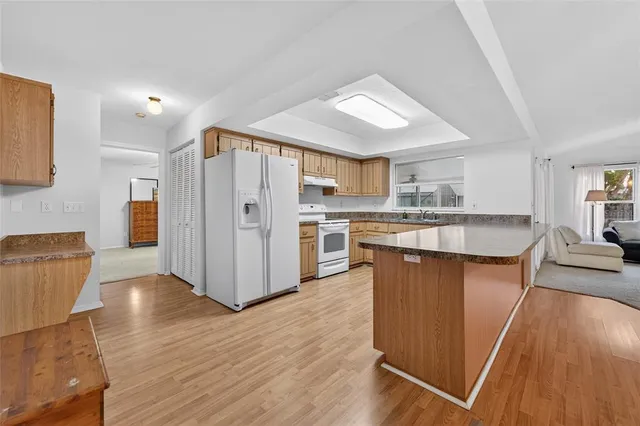 a view of a livingroom with wooden floor and chair